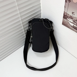 Minimalist black canvas mini crossbody bag with adjustable wide strap and zip pockets