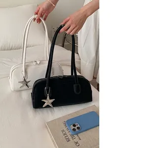 Minimalist bowling handbag for women in black and white with star pendant charm