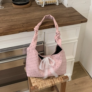 Pink polka dot canvas tote bag with a large white lace bow for casual daily wear