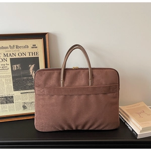Brown faux suede laptop briefcase with sturdy handles and vintage office aesthetic