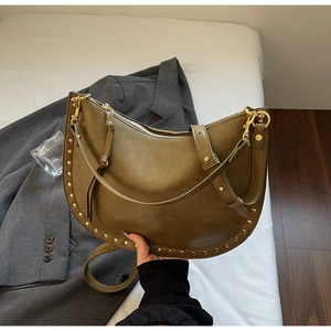 Olive green crescent shoulder bag with gold rivet studs and sleek matte leather finish