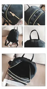 Detail of black nylon backpack showing gold metal zippers and internal storage structure