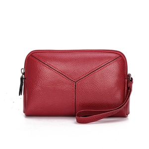 Minimalist red lychee leather wristlet phone pouch with stylish black V-shaped stitching