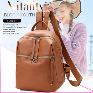 Brown litchi grain PU leather backpack with round metal rings and dual zippers details