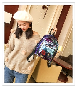 Detail of gradient sequins backpack featuring LOVE embroidery and red lip motif