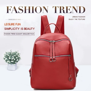 Front view of red washed PU leather backpack featuring metal ring zippers and lychee texture