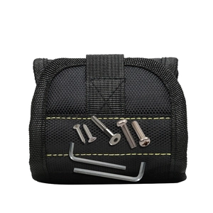 Magnetic wristband tool belt in black nylon with yellow stitching for screws and bolts