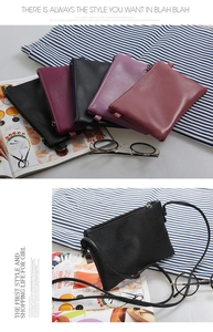 Detail of five colorful lychee texture leather crossbody bags with zipper closure