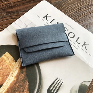 Blue matte envelope coin purse on Kinfolk magazine with a minimalist elegant design