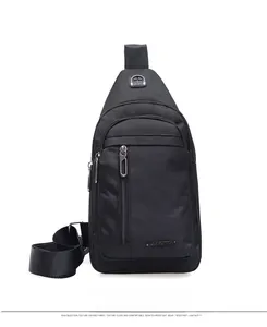 Close-up of black oxford fabric sling bag featuring earphone port and front zipper pocket