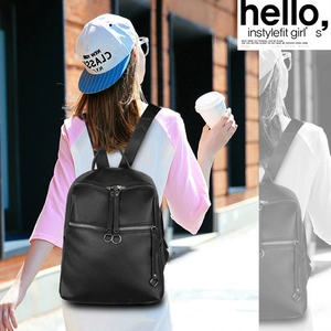 Close-up of black lychee grain PU leather backpack with multiple zipper pockets detail
