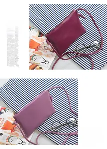 Detail view of rectangular PU leather crossbody bags in burgundy and lavender purple colors