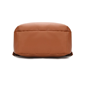 Detail view of the flat bottom on a brown lychee pattern leather backpack for women