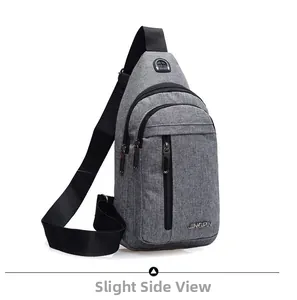 Close-up of gray textured fabric and zipper compartments on the men's crossbody chest bag