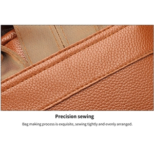Macro detail of high-quality brown washed PU leather backpack with precise double stitching
