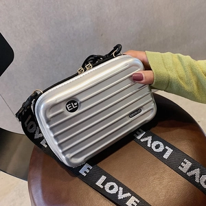 Silver mini suitcase crossbody bag with stylish wide logo strap and hard shell design