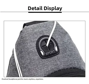 Detail of the grey crossbody bag featuring a rubberized SPORT headphone jack opening