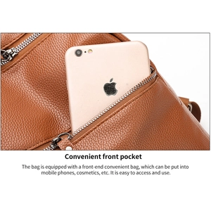 Close-up of brown washed PU leather backpack featuring silver metal ring zipper and front pocket