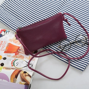 Minimalist deep red PU leather crossbody square bag with a sleek metallic zipper closure