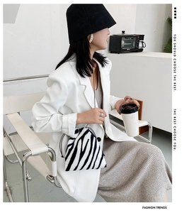 Fashionable zebra print plush bucket bag with drawstring closure for winter style