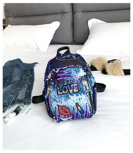 Detail of blue purple gradient sequins and LOVE patch on this fashion backpack