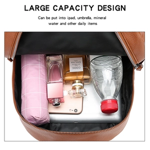 Interior view of brown PU leather backpack showing large capacity for tablet and daily items