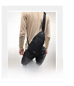 Detailed back view of a black casual chest bag for men with waterproof nylon texture