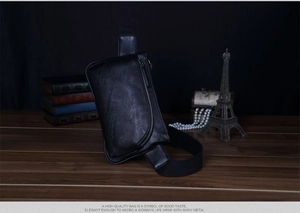 Men's stylish black leather chest bag with adjustable strap and metallic zipper closure