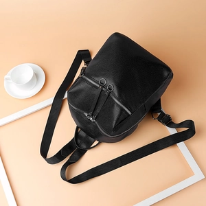 Fashionable black washed PU leather backpack for women with round silver zippers and straps