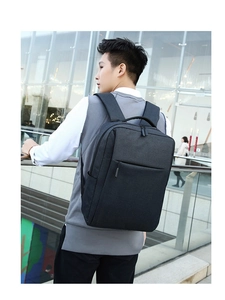 Close-up of black business backpack with waterproof fabric and USB charging port detail