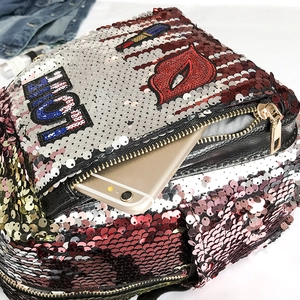 Fashionable sequin backpack with red lip and HOT patches in a high-quality top view layout