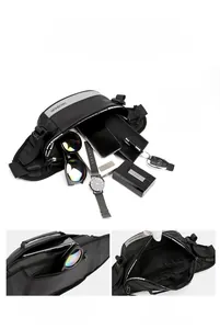 Detail of black waterproof nylon waist bag showing multiple pockets and large capacity