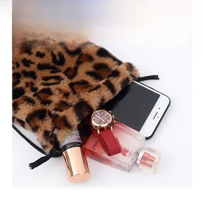 Detail view showing interior capacity of leopard print plush bucket bag with drawstring