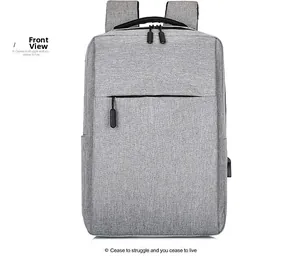 Front view of grey business laptop backpack featuring a USB charging port and sleek fabric