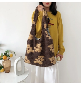 Close-up of fuzzy teddy bear pattern tote bag with soft plush texture and interior lining