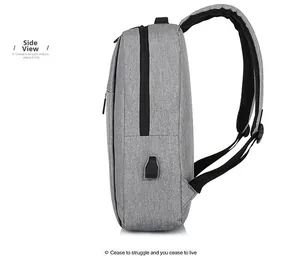 Detail view of grey minimalist backpack showing the external USB charging port and side zipper