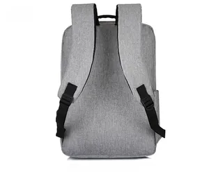 Rear view of grey business backpack showing padded straps and durable polyester texture