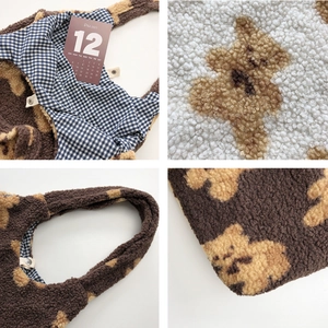 Detail view of plush bear tote bag featuring soft lamb wool fabric and checkered lining