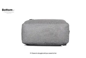 Detailed bottom view of the grey fabric laptop backpack showing texture and stitching