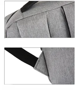 Detail view of high-density oxford fabric and reinforced stitching on the gray backpack