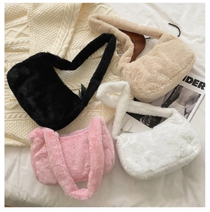 Selection of soft faux fur shoulder bags in black, pink, white, and beige colors
