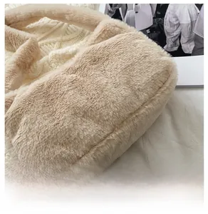 Close-up of fluffy apricot faux fur bag base showing soft texture and cozy plush material