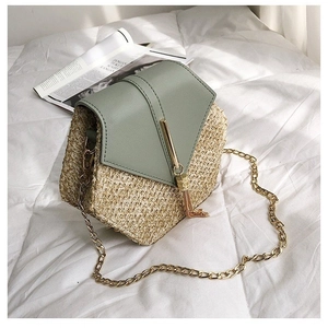 Straw crossbody bag with sage green leather flap, gold chain strap and fringe tassel