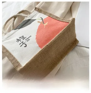 Detailed close-up of the canvas tote bag showing the jute bottom and woven rope handle