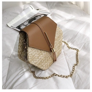Chic woven straw square bag with brown leather flap and golden fringe chain strap