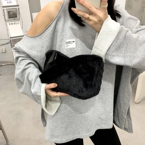 Chic black faux fur shoulder bag for women with fluffy texture and sleek zipper closure