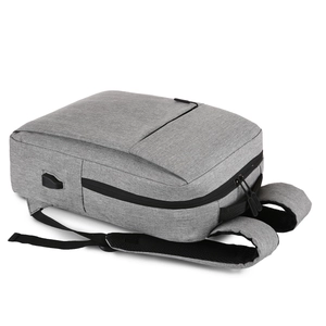 Grey minimalist business laptop backpack with external USB charging port and padded straps
