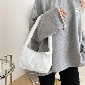 Minimalist white faux fur shoulder bag with soft plush texture for winter fashion