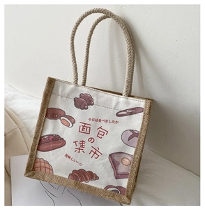 Detail of canvas tote bag with jute trim and hand-drawn bakery pattern illustrations