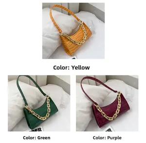 Trio of crocodile texture baguette bags in yellow, green, and purple with gold chain details